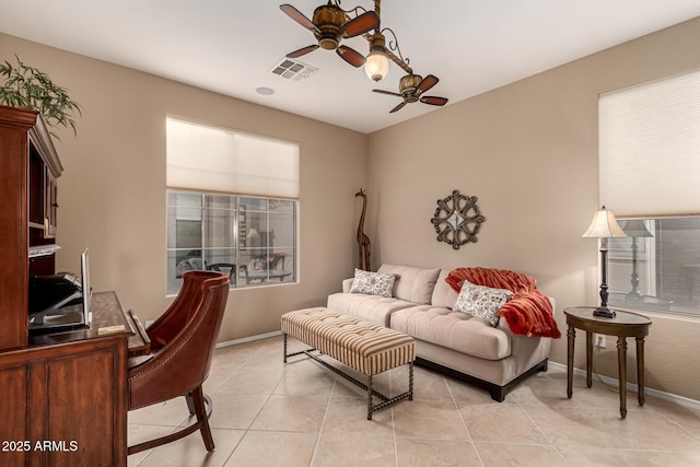 living room featuring ceiling fan and light tile patterned floors