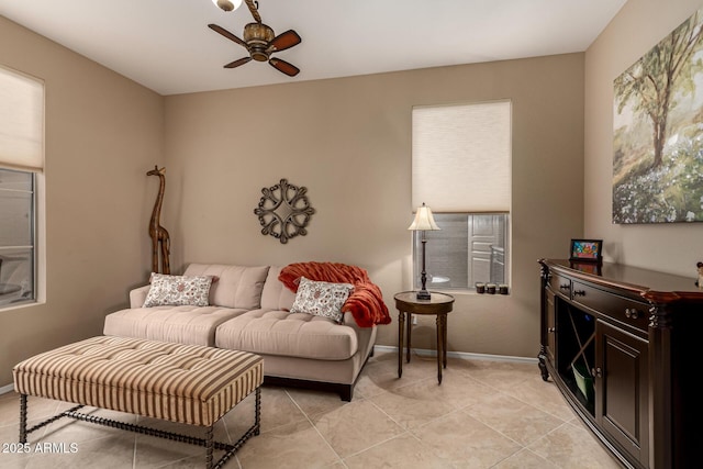 tiled living room with ceiling fan