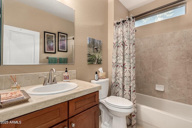 full bathroom featuring toilet, vanity, and shower / bathtub combination with curtain