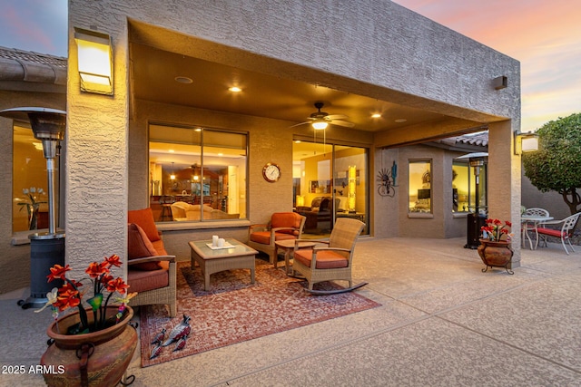 patio terrace at dusk with ceiling fan