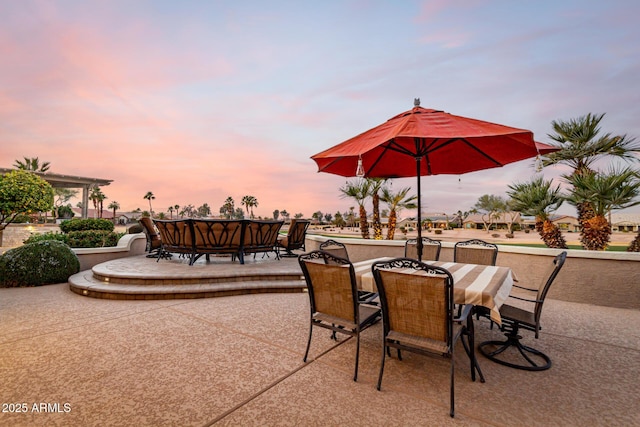 view of patio terrace at dusk