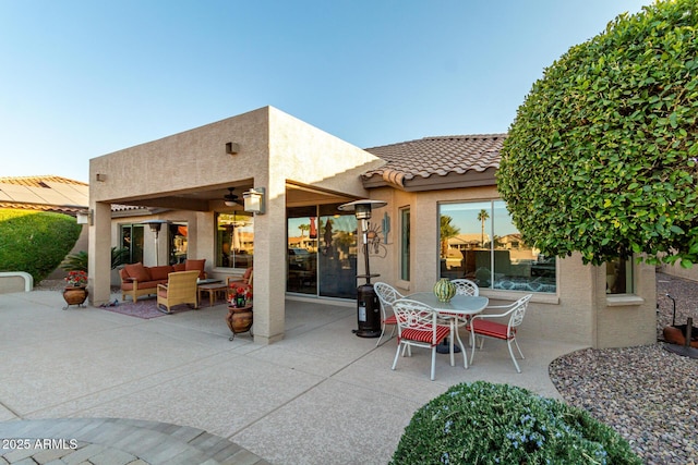 view of patio featuring an outdoor living space and ceiling fan