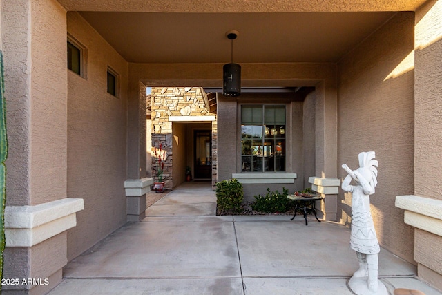 entrance to property with a patio