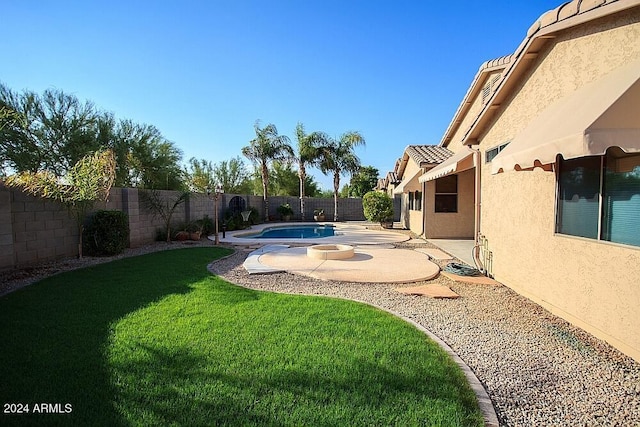 view of yard featuring a fenced in pool and a patio