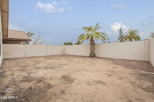 view of yard with a fenced backyard