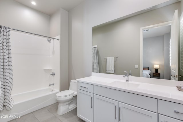 4438 N 27th St Unit 27, Phoenix, AZ 85016 - bathroom with vanity, toilet, ensuite bathroom, shower / tub combo with curtain, and tile patterned flooring