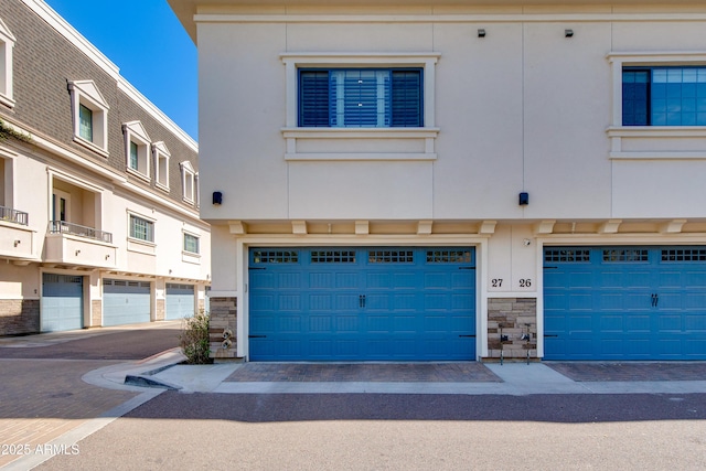 4438 N 27th St Unit 27, Phoenix, AZ 85016 - view of front of property with stone siding and a garage