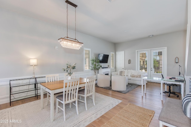 4438 N 27th St Unit 27, Phoenix, AZ 85016 - dining area featuring light wood-style floors, french doors, and a desk