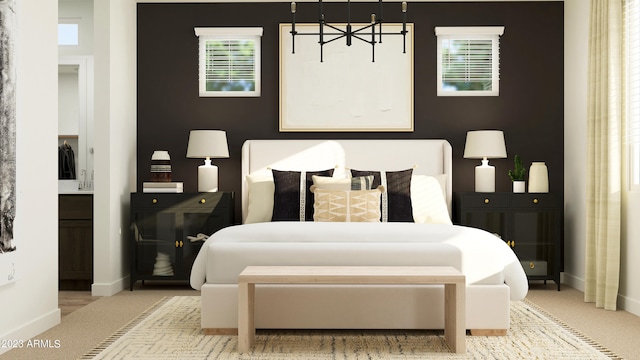 bedroom with baseboards, multiple windows, and a chandelier