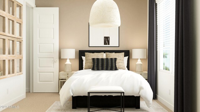 bedroom featuring carpet and baseboards
