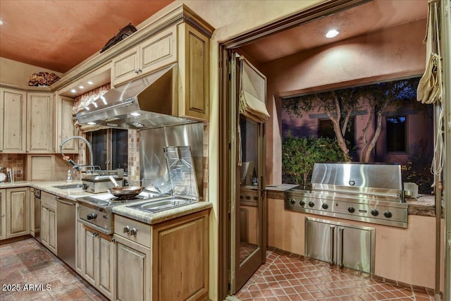 7710 E Golden Eagle Cir, Gold Canyon, AZ 85118 - kitchen with light countertops, under cabinet range hood, stainless steel appliances, cream cabinetry, and tasteful backsplash