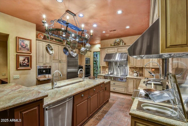 7710 E Golden Eagle Cir, Gold Canyon, AZ 85118 - kitchen featuring under cabinet range hood, a sink, stainless steel appliances, light stone countertops, and recessed lighting