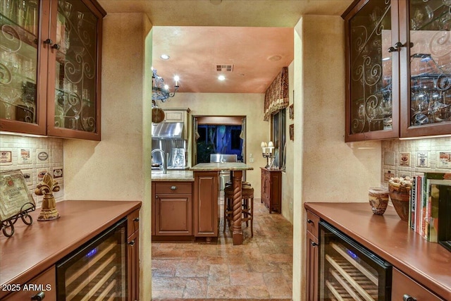 7710 E Golden Eagle Cir, Gold Canyon, AZ 85118 - indoor dry bar featuring beverage cooler, light stone finish floors, decorative backsplash, and a textured wall