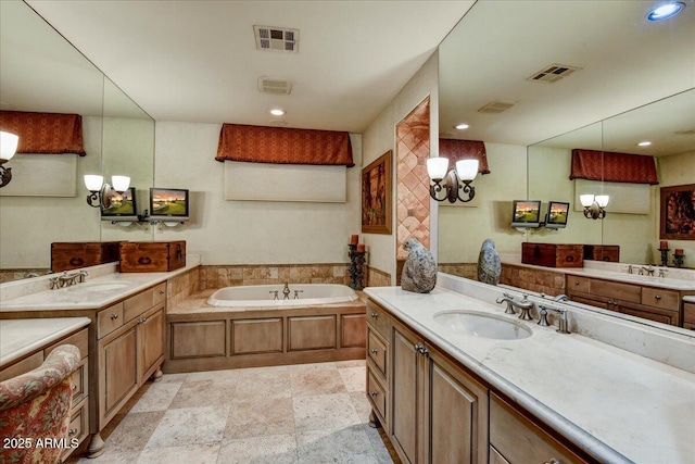 7710 E Golden Eagle Cir, Gold Canyon, AZ 85118 - bathroom featuring a chandelier, a garden tub, vanity, recessed lighting, and stone finish flooring