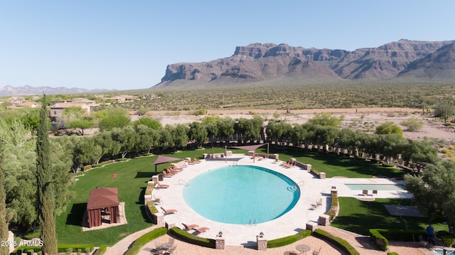 7710 E Golden Eagle Cir, Gold Canyon, AZ 85118 - drone / aerial view of a mountain backdrop and a pool
