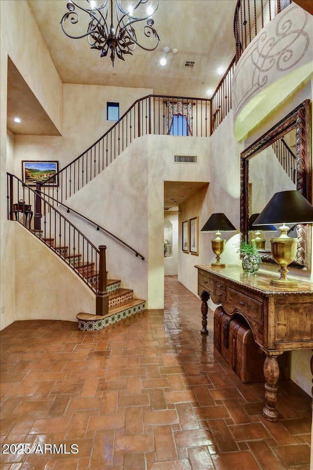 7710 E Golden Eagle Cir, Gold Canyon, AZ 85118 - entrance foyer with a towering ceiling, a chandelier, and stairway