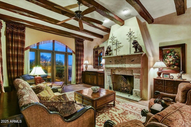7710 E Golden Eagle Cir, Gold Canyon, AZ 85118 - living room with beam ceiling, a ceiling fan, and a fireplace with raised hearth