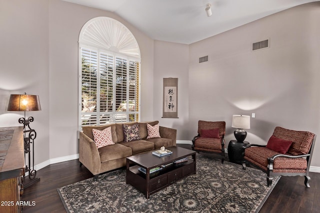 3733 E Kachina Dr, Phoenix, AZ 85044 - living area with baseboards, wood finished floors, and vaulted ceiling