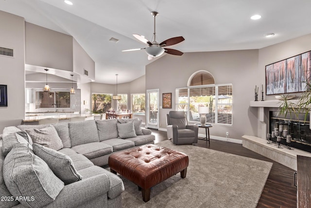 3733 E Kachina Dr, Phoenix, AZ 85044 - living area with a fireplace, ceiling fan, recessed lighting, wood finished floors, and baseboards