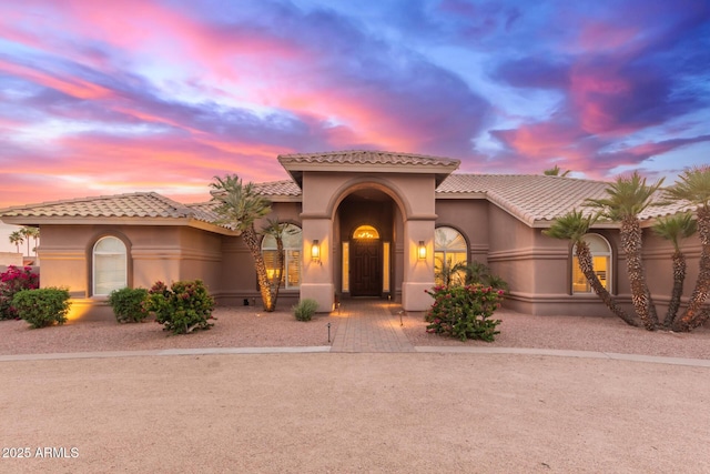 3733 E Kachina Dr, Phoenix, AZ 85044 - mediterranean / spanish-style house featuring a tile roof, stucco siding, and decorative driveway