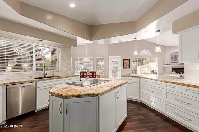 3733 E Kachina Dr, Phoenix, AZ 85044 - kitchen with stainless steel dishwasher, a sink, black electric stovetop, backsplash, and a center island