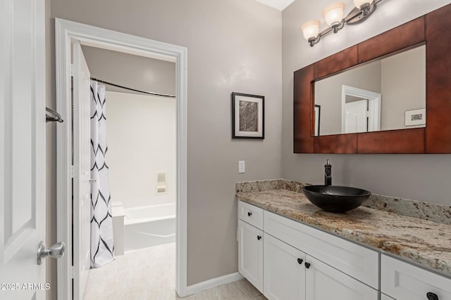 3733 E Kachina Dr, Phoenix, AZ 85044 - bathroom featuring vanity, shower / bath combo, and baseboards