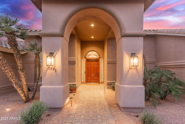 3733 E Kachina Dr, Phoenix, AZ 85044 - exterior entry at dusk featuring stucco siding