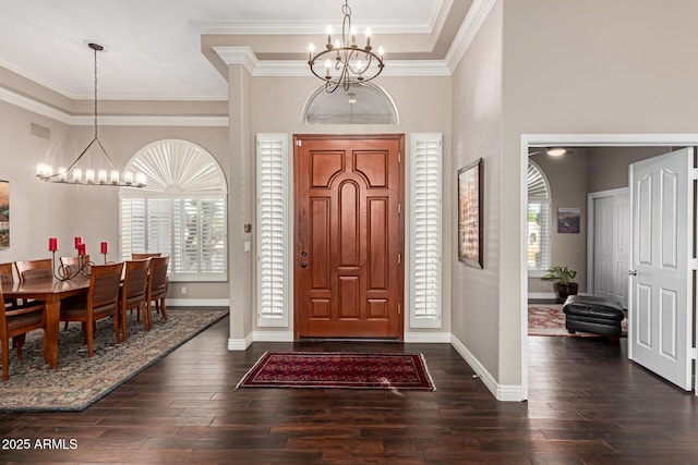 3733 E Kachina Dr, Phoenix, AZ 85044 - entrance foyer with a chandelier, ornamental molding, dark wood finished floors, baseboards, and a high ceiling