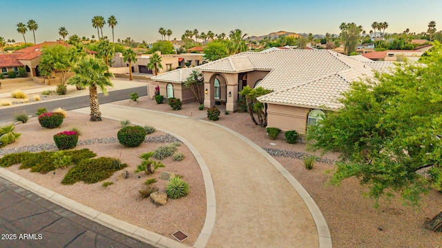 3733 E Kachina Dr, Phoenix, AZ 85044 - mediterranean / spanish home featuring a tile roof, stucco siding, and a residential view