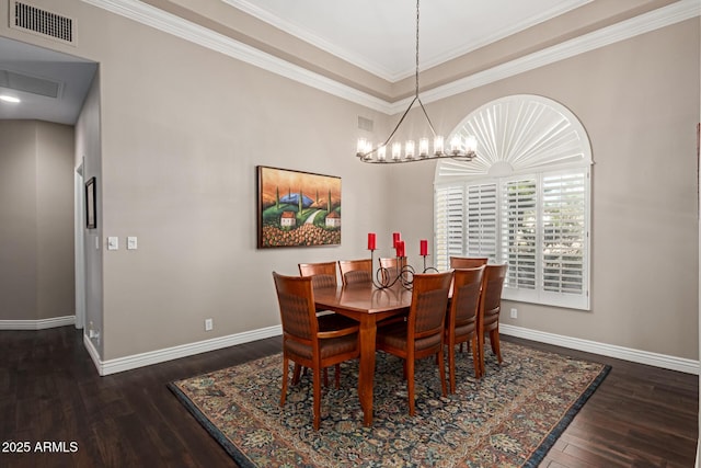 3733 E Kachina Dr, Phoenix, AZ 85044 - dining area with wood finished floors, baseboards, crown molding, and a chandelier