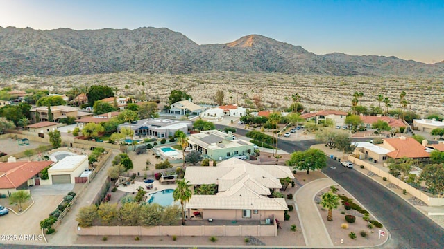 3733 E Kachina Dr, Phoenix, AZ 85044 - aerial view of property and surrounding area with nearby suburban area, a mountainous background, and a pool area