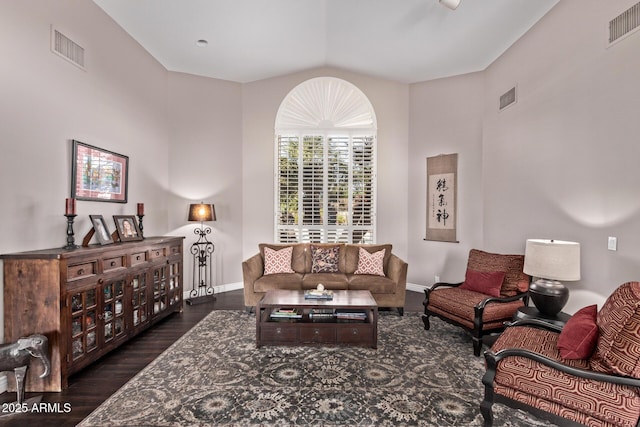 3733 E Kachina Dr, Phoenix, AZ 85044 - living room featuring wood finished floors, vaulted ceiling, and baseboards