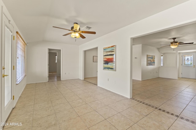 spare room with ceiling fan and light tile patterned floors