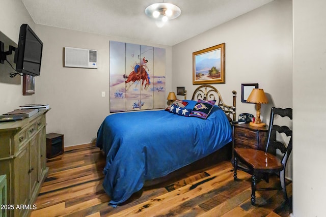 51238 N Pinal Ranch Rd, Miami, AZ 85539 - bedroom with a wall mounted AC and wood finished floors