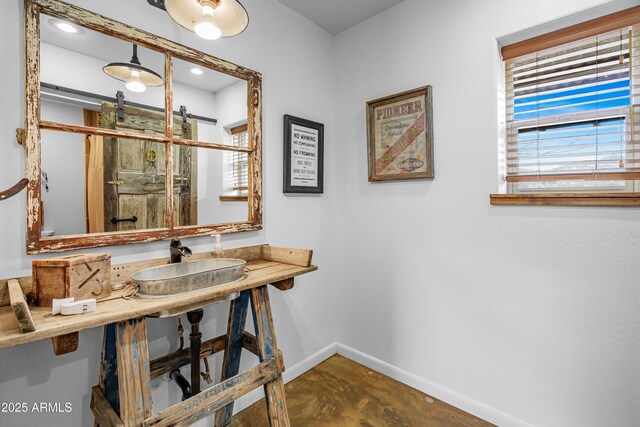 51238 N Pinal Ranch Rd, Miami, AZ 85539 - bathroom with a shower with door, a sink, and baseboards