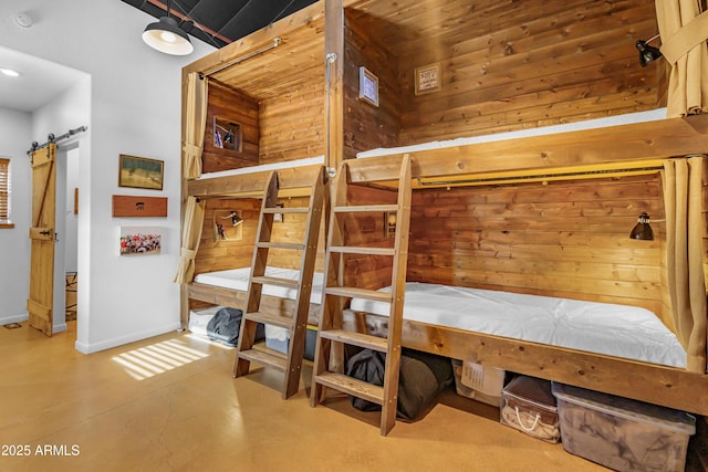 51238 N Pinal Ranch Rd, Miami, AZ 85539 - bedroom with finished concrete floors and a barn door