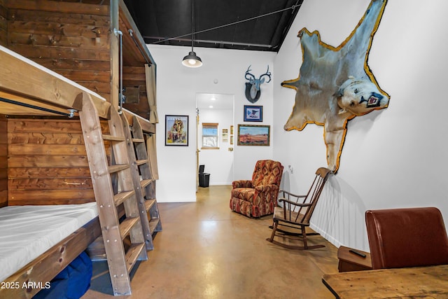 51238 N Pinal Ranch Rd, Miami, AZ 85539 - bedroom with a high ceiling and concrete flooring
