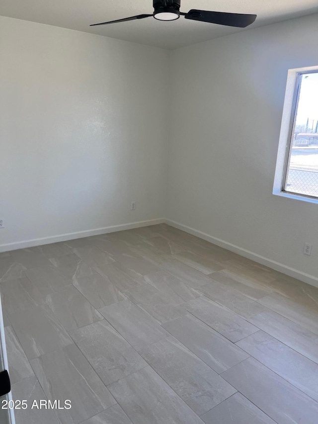 spare room featuring ceiling fan