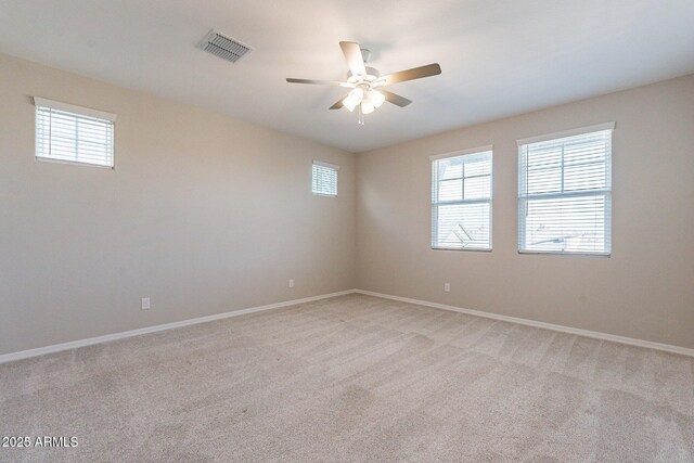 613 W Winchester Dr, Chandler, AZ 85286 - spare room featuring a ceiling fan, light colored carpet, and baseboards