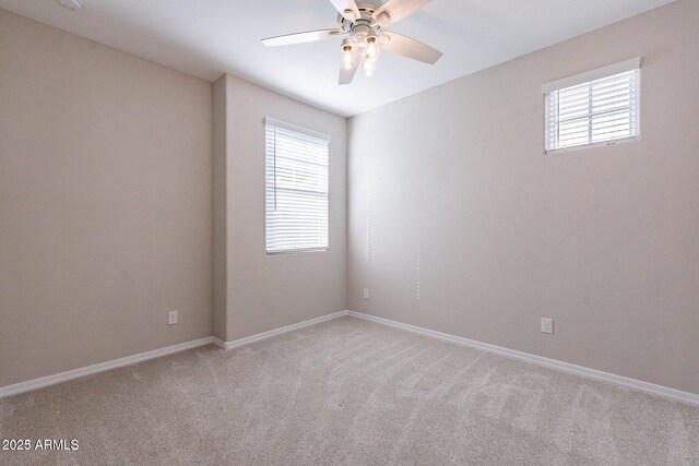 613 W Winchester Dr, Chandler, AZ 85286 - empty room featuring plenty of natural light, a ceiling fan, light carpet, and baseboards