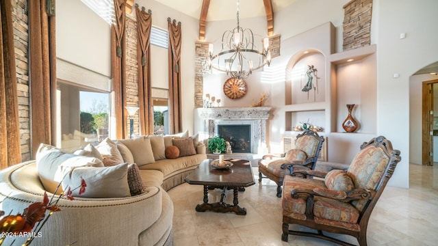 living room featuring a towering ceiling and a notable chandelier