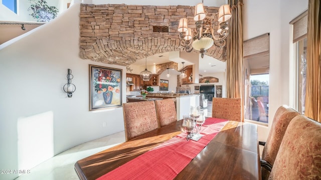 dining area with an inviting chandelier