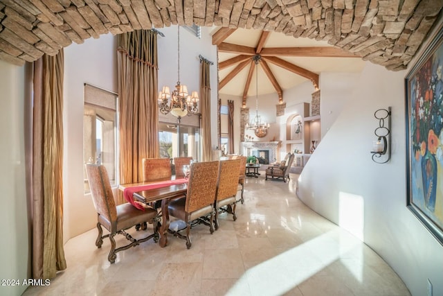 dining room featuring beamed ceiling, high vaulted ceiling, and an inviting chandelier