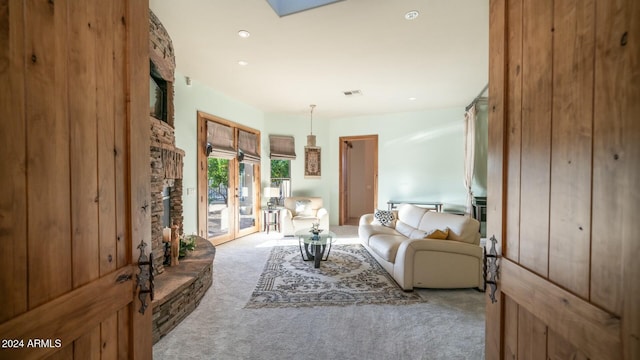 living room featuring light colored carpet