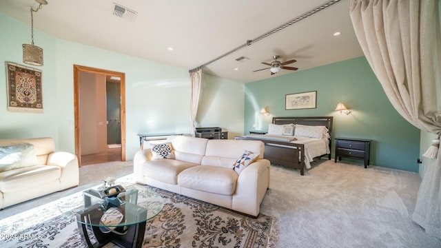 bedroom featuring light carpet and ceiling fan