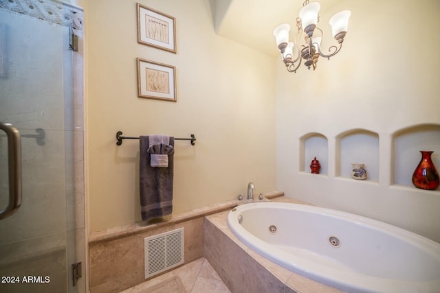 bathroom with tile patterned flooring, a chandelier, and independent shower and bath