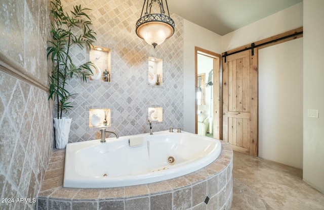 bathroom with a relaxing tiled tub and tile walls