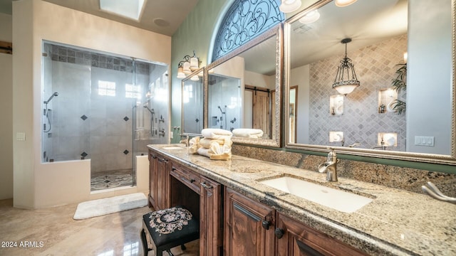 bathroom featuring vanity and a shower with shower door