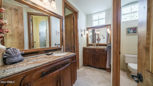 bathroom with vanity and toilet