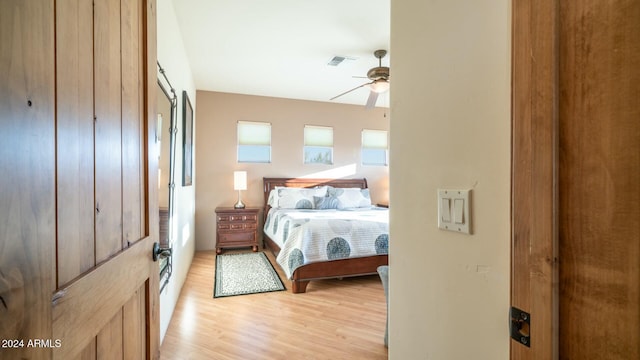 bedroom featuring ceiling fan and light hardwood / wood-style floors